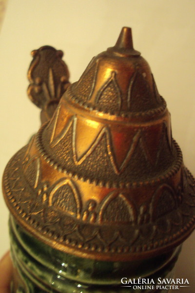 German, green-glazed, plastic-surfaced ceramic beer mug with an openable patterned red copper lid.