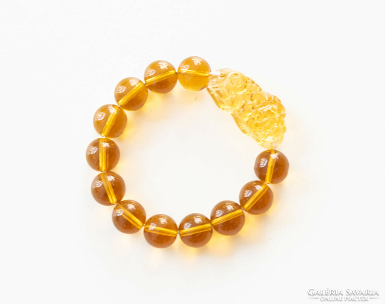 Chinese lucky bracelet made of glass beads - with a lion figure - amber color