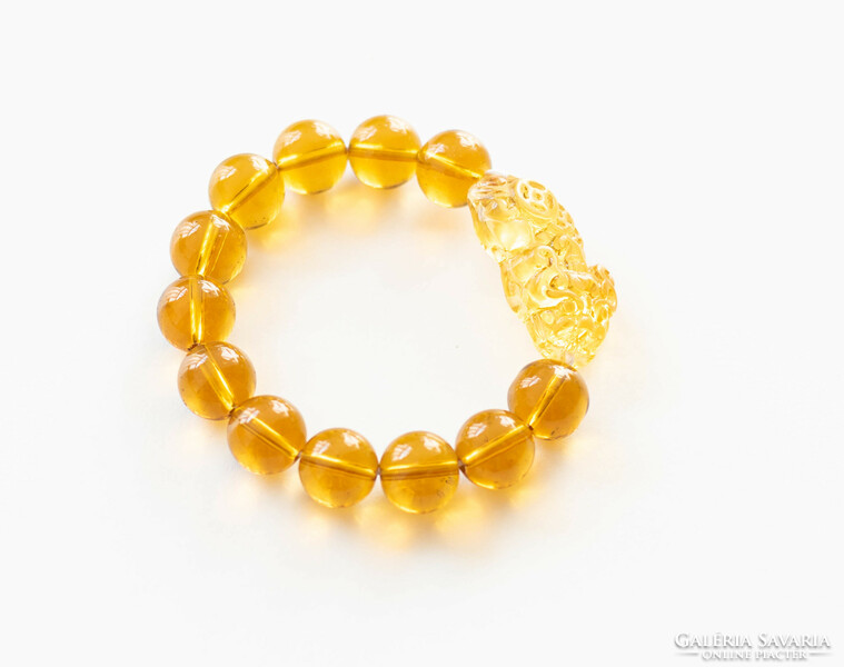 Chinese lucky bracelet made of glass beads - with a lion figure - amber color