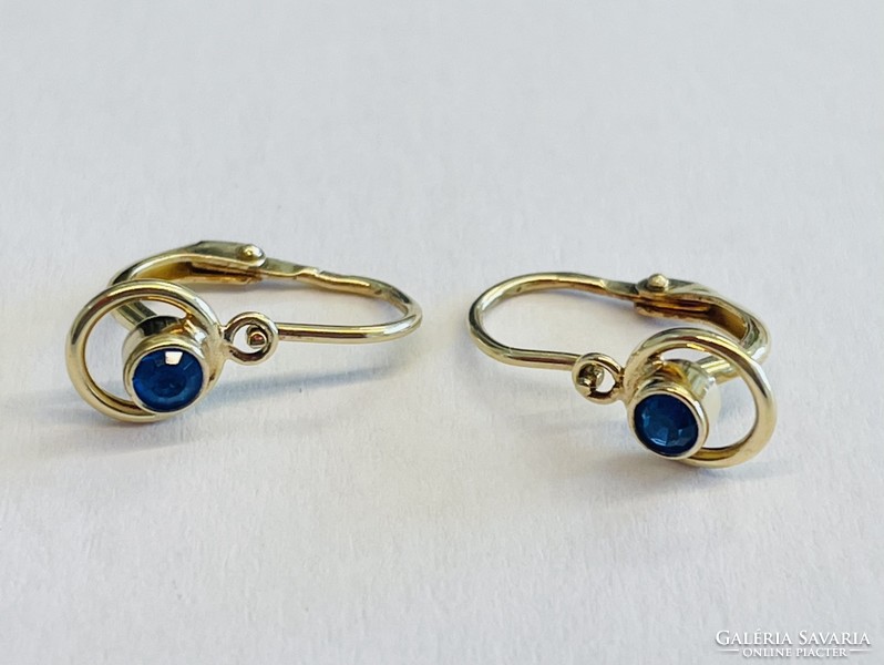 Gold baby earrings with blue stones