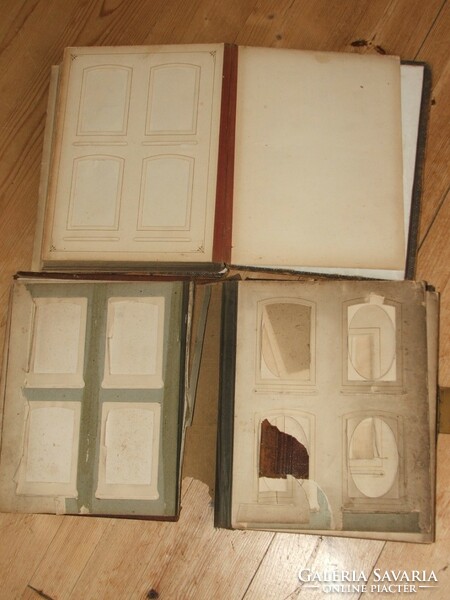 Two antique leather-covered photo albums