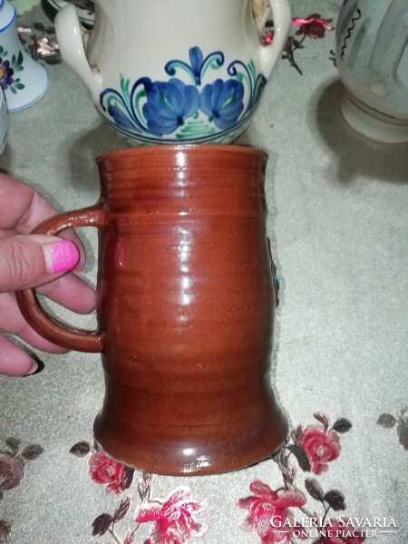 Ceramic jug is in the condition shown in the pictures