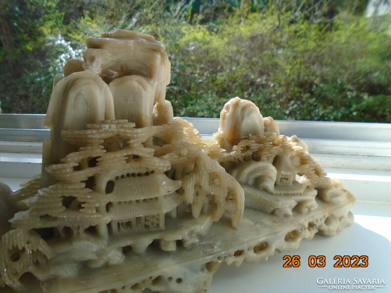 Chinese hand carved high mountain landscape with pine trees and temple