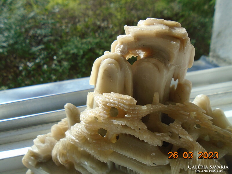 Chinese hand carved high mountain landscape with pine trees and temple