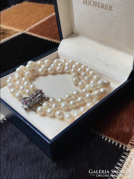 Old three-row genuine pearl bracelet with silver clasp and ruby stones