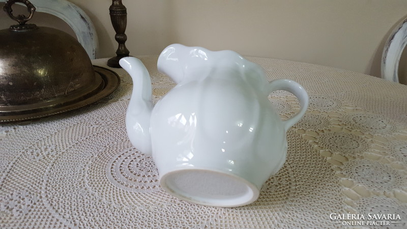 Old, very thick white porcelain teapot, jug