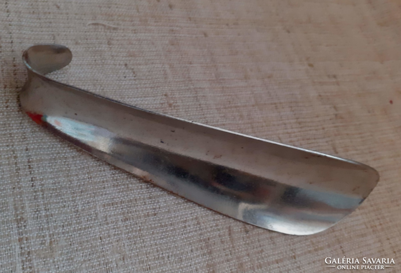 Old marked metal shoe spoon in usable condition