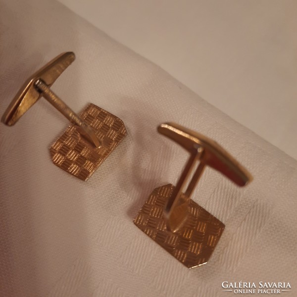 A pair of gold-colored, mother-of-pearl inlaid, domino pattern cufflinks