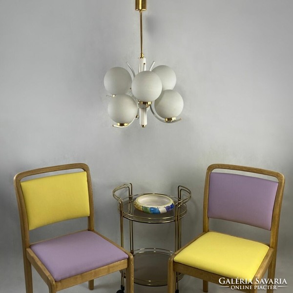A pair of Scandinavian solid wood chairs urbanized. Pastel purple-yellow vegan leather