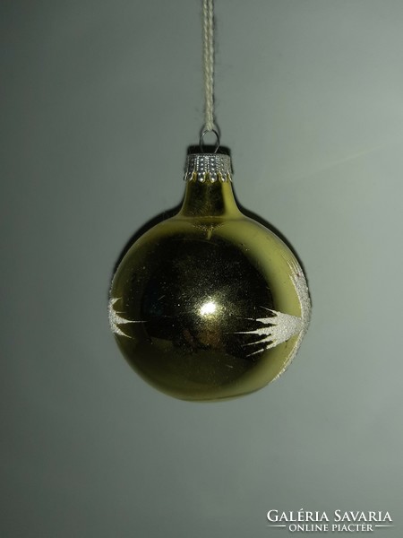 Old glass sphere Christmas tree ornament with snowy pattern