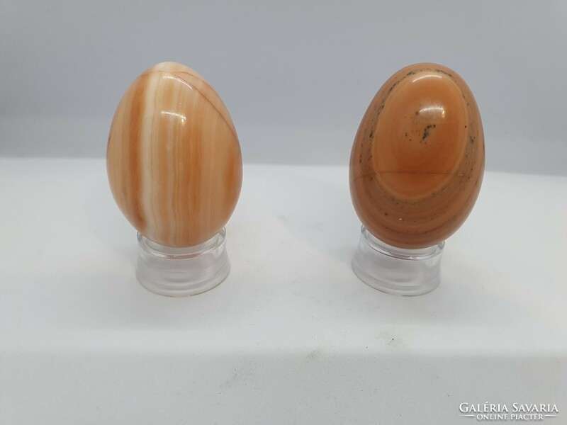 Onyx marble mineral eggs on a plastic holder