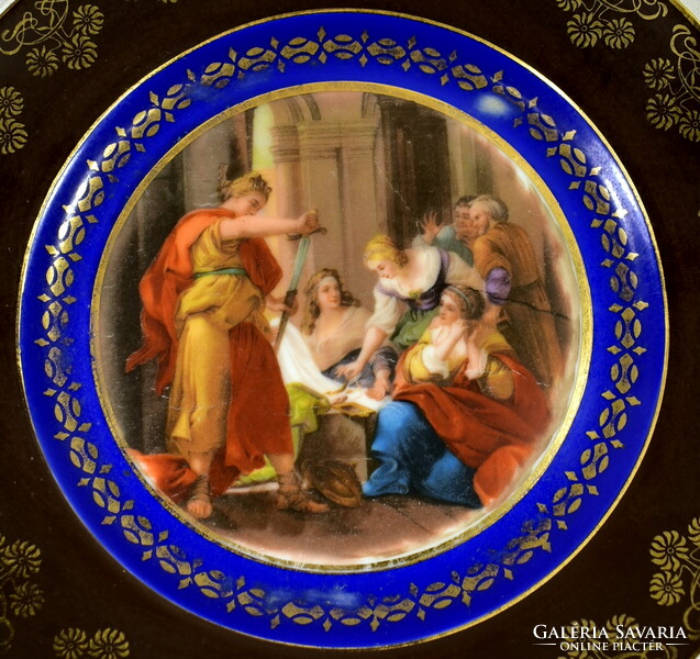 A porcelain decorative plate with historicizing scene marked Alt Wien