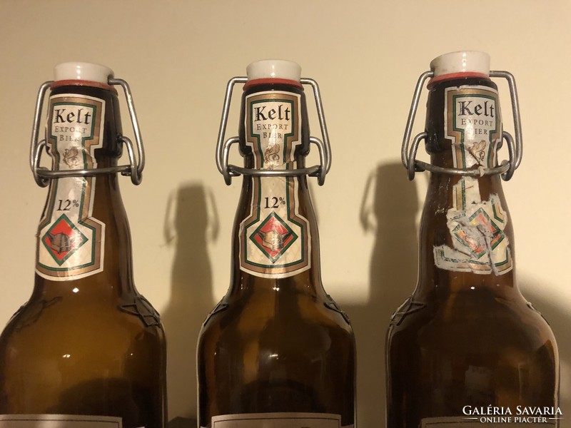 3 beer bottles with buckles