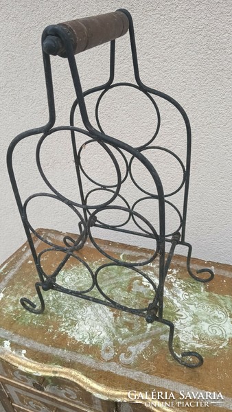 Wrought iron wine holder is negotiable