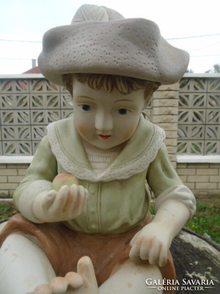 Large porcelain German Bavarian boy with an apple in his hand with two minor flaws, very nice