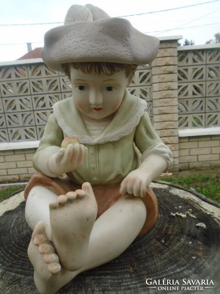 Large porcelain German Bavarian boy with an apple in his hand with two minor flaws, very nice