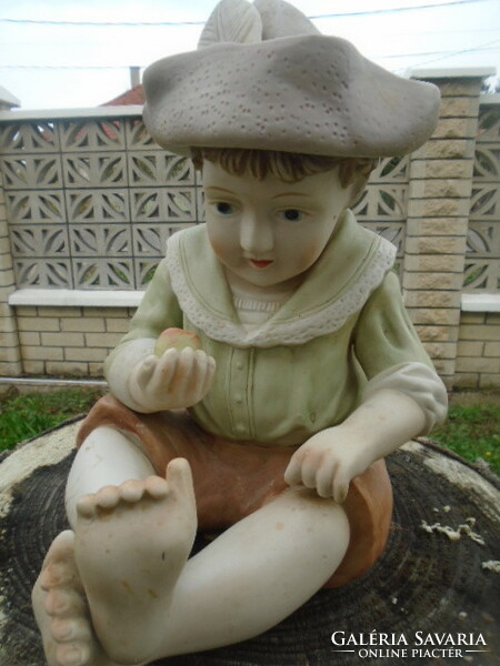 Large porcelain German Bavarian boy with an apple in his hand with two minor flaws, very nice