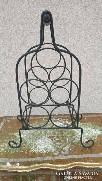 Wrought iron wine holder is negotiable