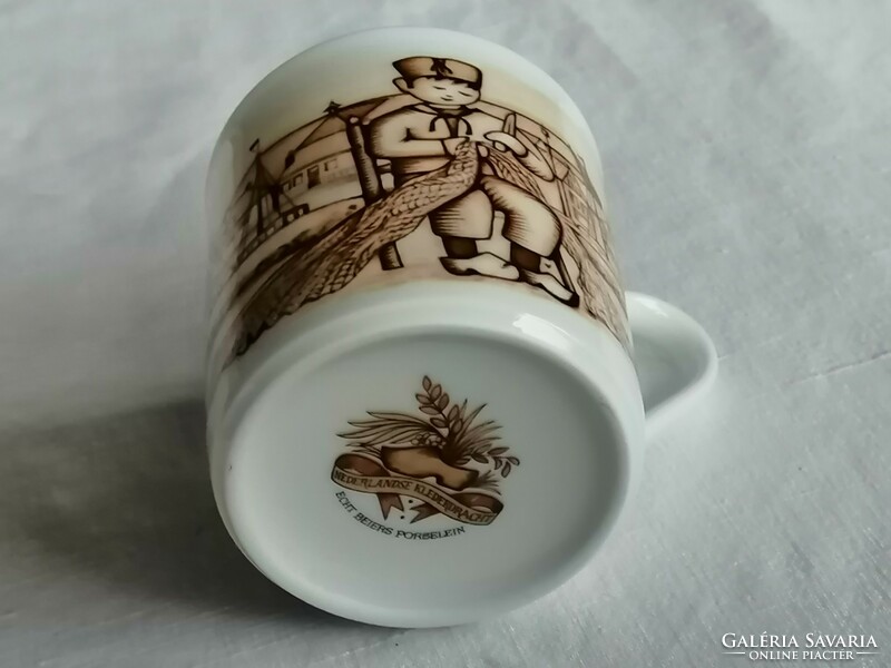Small porcelain mug _ one of the pieces of the Dutch folk costume series _ urk