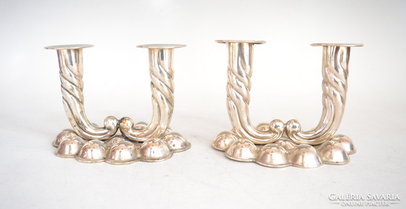 Silver two-pronged candlestick in pairs