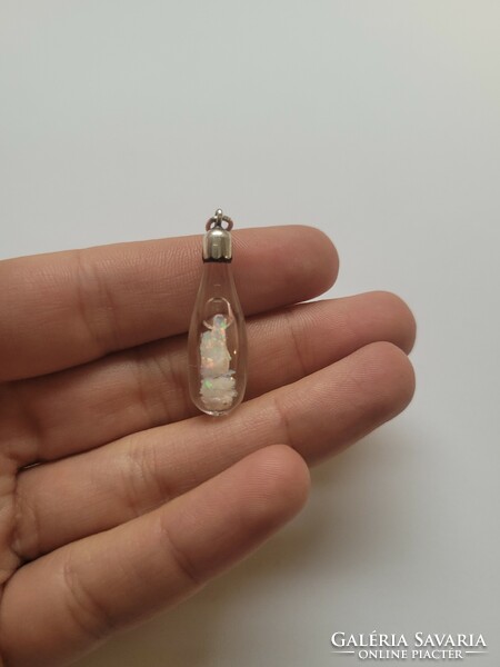 Rare raw Ethiopian rainbow opal in silver and glass pendant