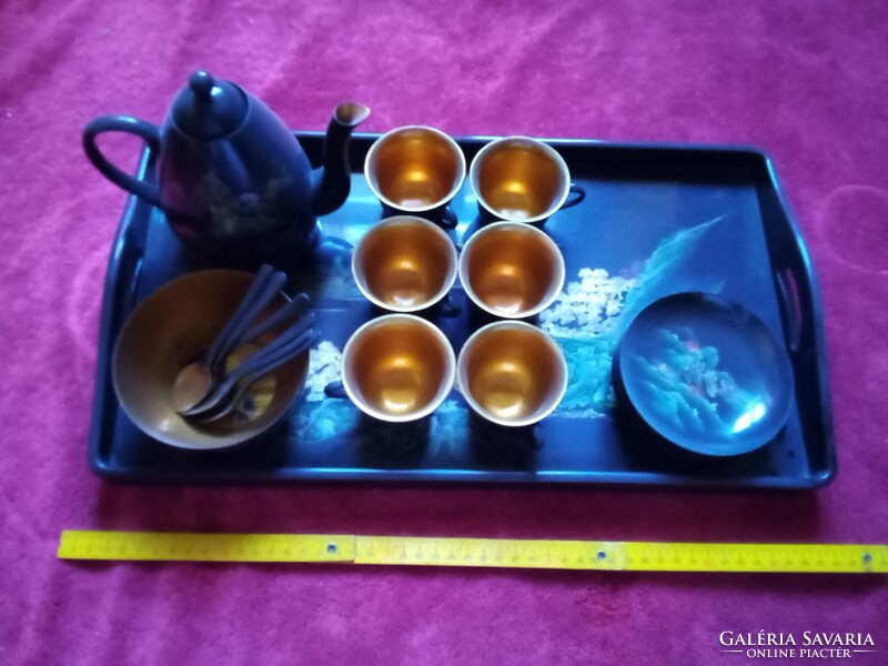 Lacquered coffee set kept in a display case, never used