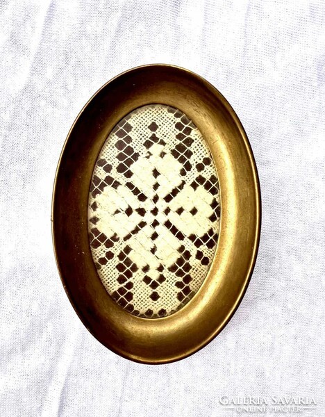 Brass ring bowl with crocheted lace tablecloth insert