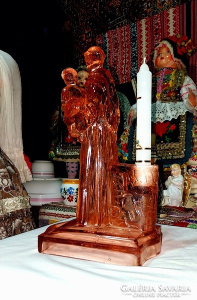 Antique cast glass holy relic with baby Jesus in the arms of Saint Antal. Beautiful candlestick behind him, r