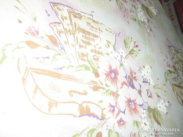 A beautiful vintage-style bed linen set with a floral violin sheet music pattern