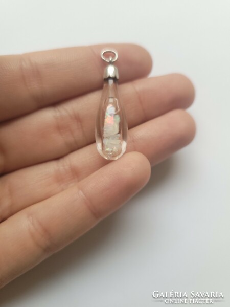 Rare raw Ethiopian rainbow opal in silver and glass pendant