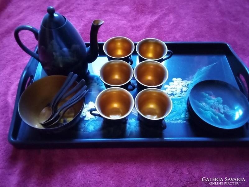 Lacquered coffee set kept in a display case, never used