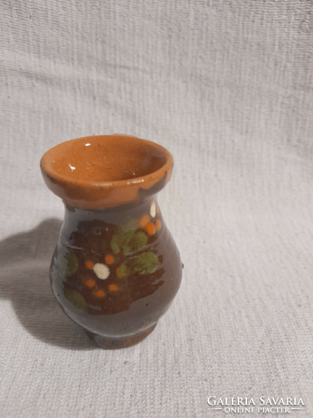 Brown glazed, flowery little ceramic doll
