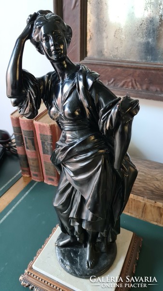 Female statue, on a marble base