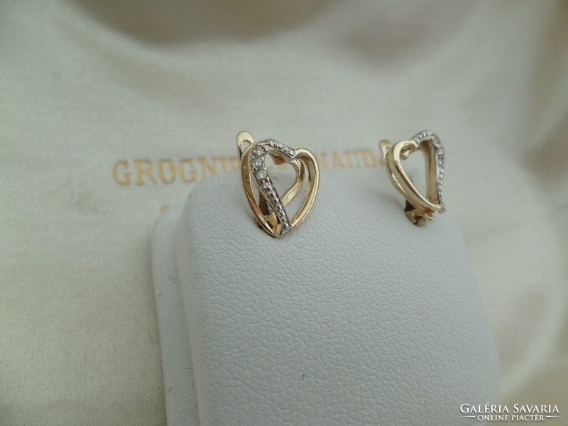 Gold heart earrings with a couple of small diamonds