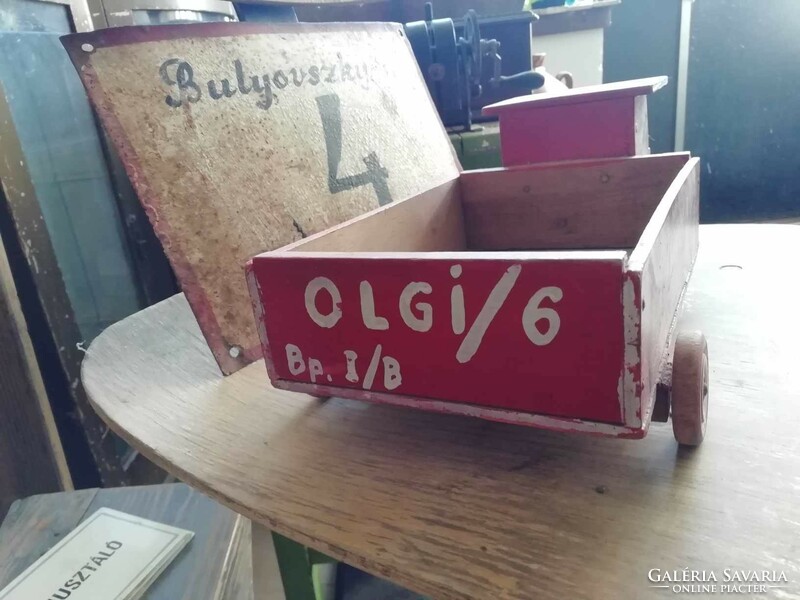 Wooden van from the 1960s with a public sign on the side and unique decoration, retro toy