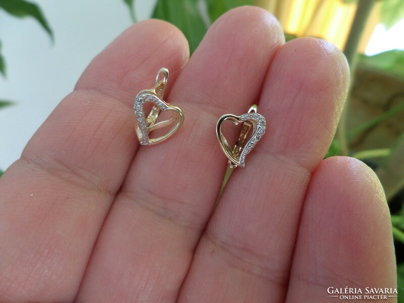 Gold heart earrings with a couple of small diamonds