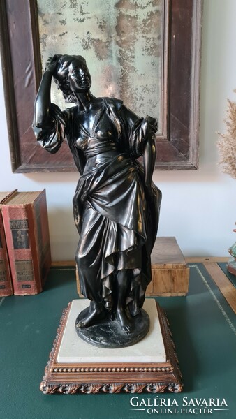 Female statue, on a marble base