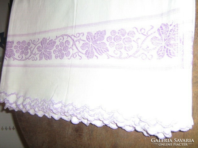 Beautiful antique white woven soft sheet with a purple vine pattern with a slinged edge