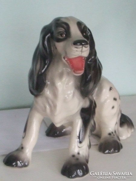 Large spaniel dog statue.