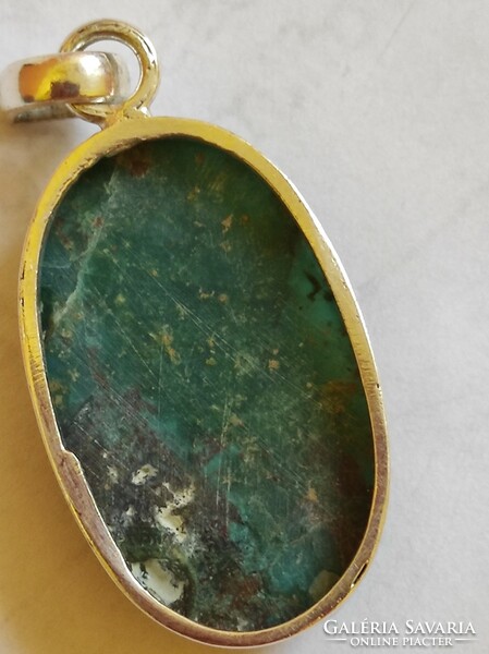 Handmade chrysocolla pendant with a silver socket