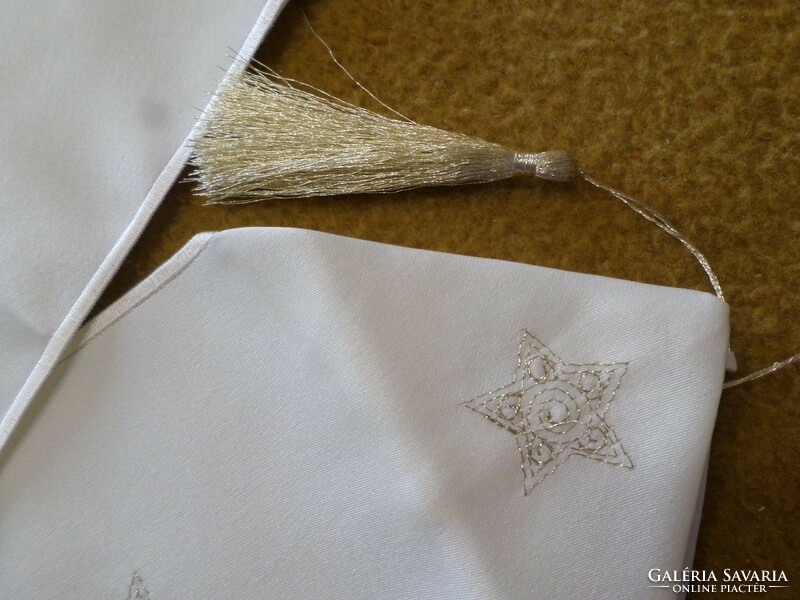 Embroidered cream-gold long tablecloth with gold tassel at the end.