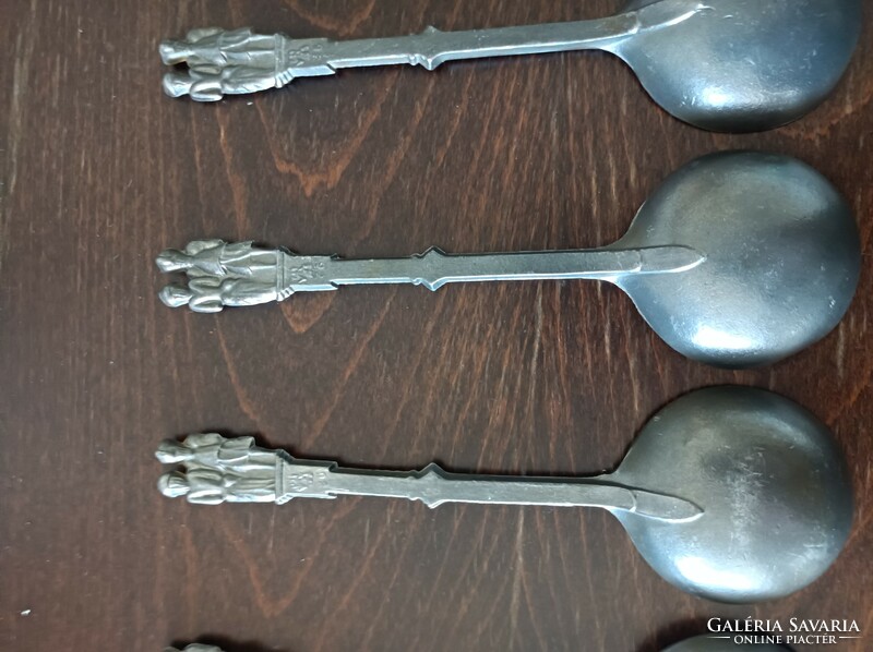 4 tin spoons marked