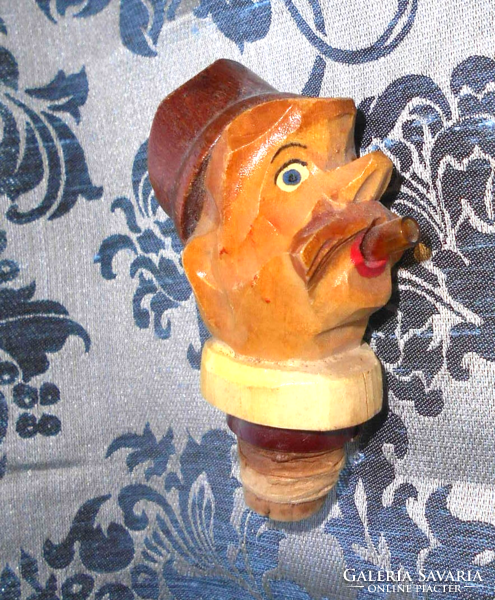 Antique carved stopper with spout on the mouth