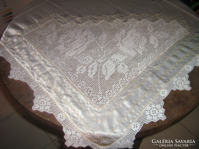 Beautiful elegant rose with lace insert and silk tablecloth with lacy edges