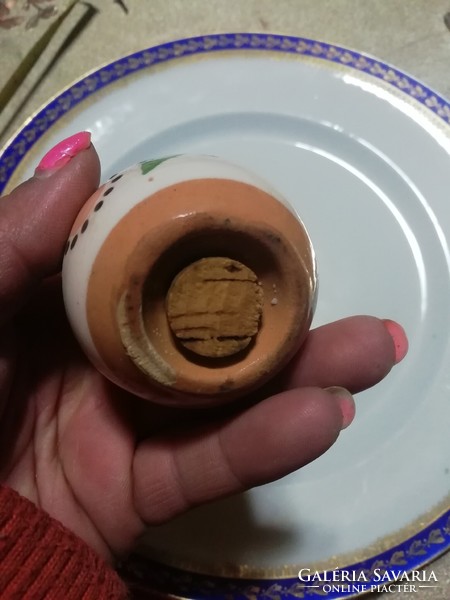 Ceramic egg-shaped salt holder 12.