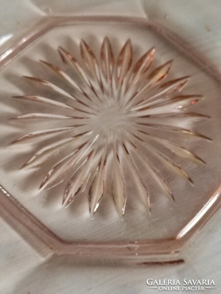 A pink engraved antique glass cake plate in the shape of a flawless flower