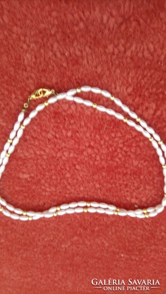 Old freshwater pearl, beautifully re-strung with its original switch from 1970