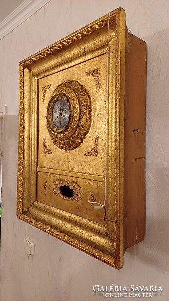 Antique Biedermeier frame clock in an ox-eye laminated frame. Wall clock.