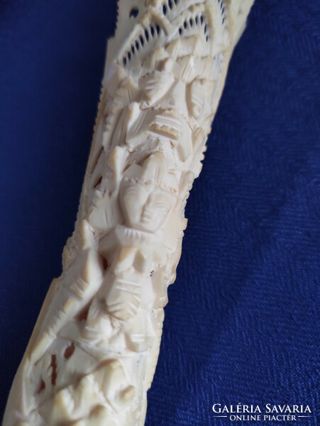 Totem sculpture carved from deer leg bone