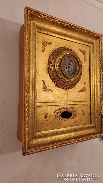 Antique Biedermeier frame clock in an ox-eye laminated frame. Wall clock.